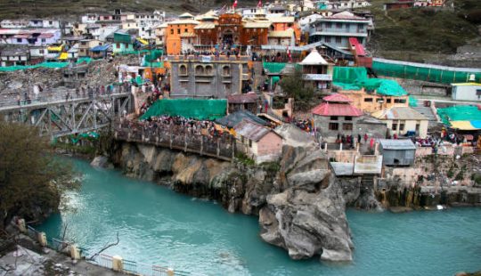 Badrinath,uttarakhand,India-Image of Badrinath temple from a distance showing alaknanda river in front.